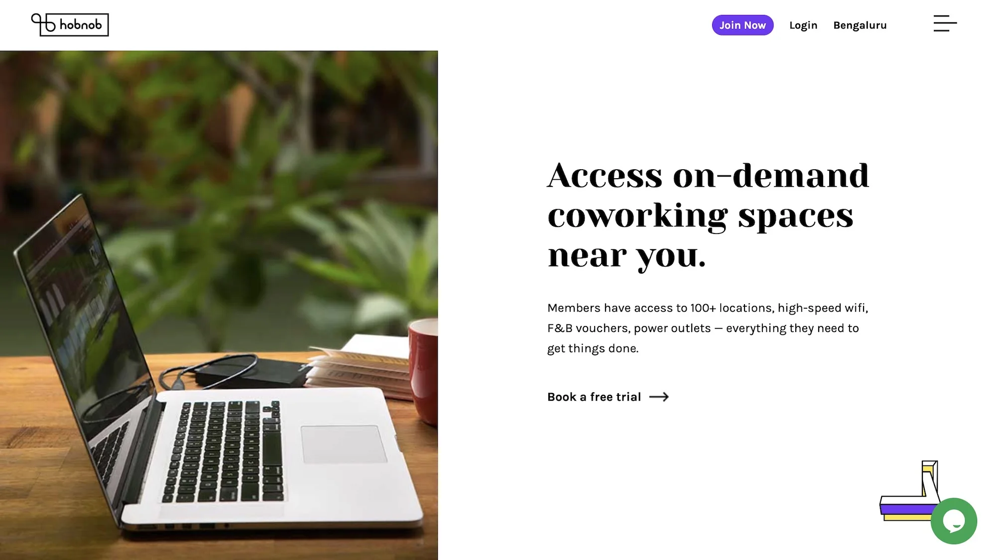 The Hobnob homepage: Access on-demand coworking spaces near you, beside a laptop on a café table