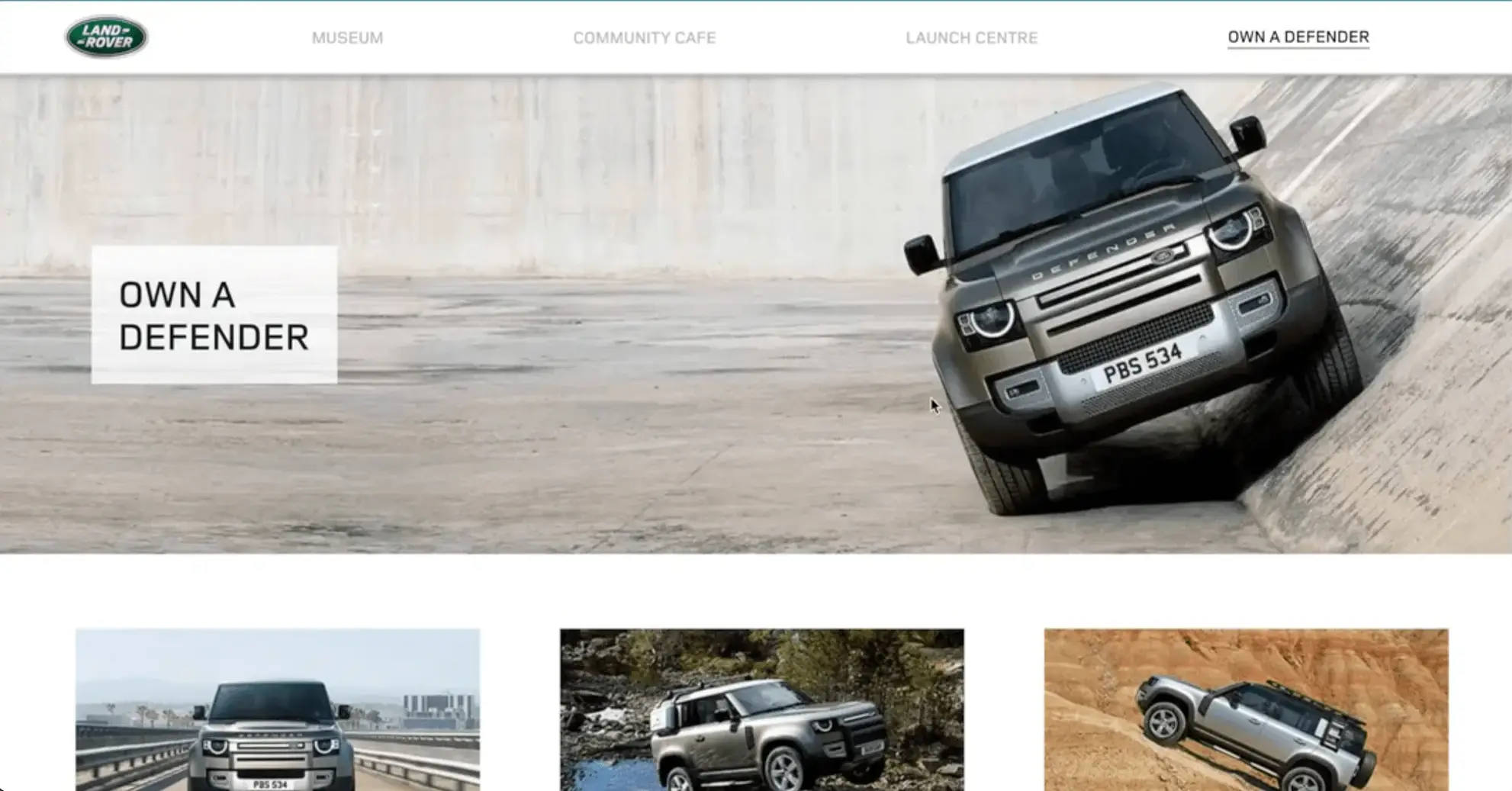 The Own a Defender page, with a Defender climbing a steep concrete bank